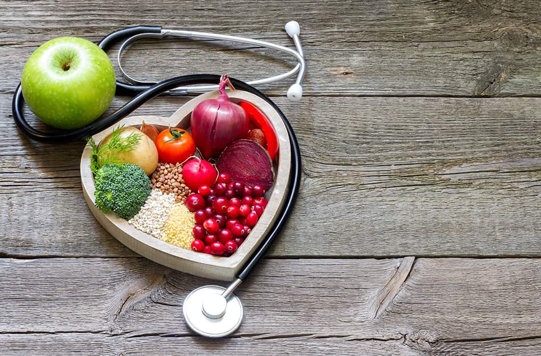 Heart-shaped bowl with healthy foods and stethoscope - Total Health Chiropractic Wellness Clinic in Cork, Ireland